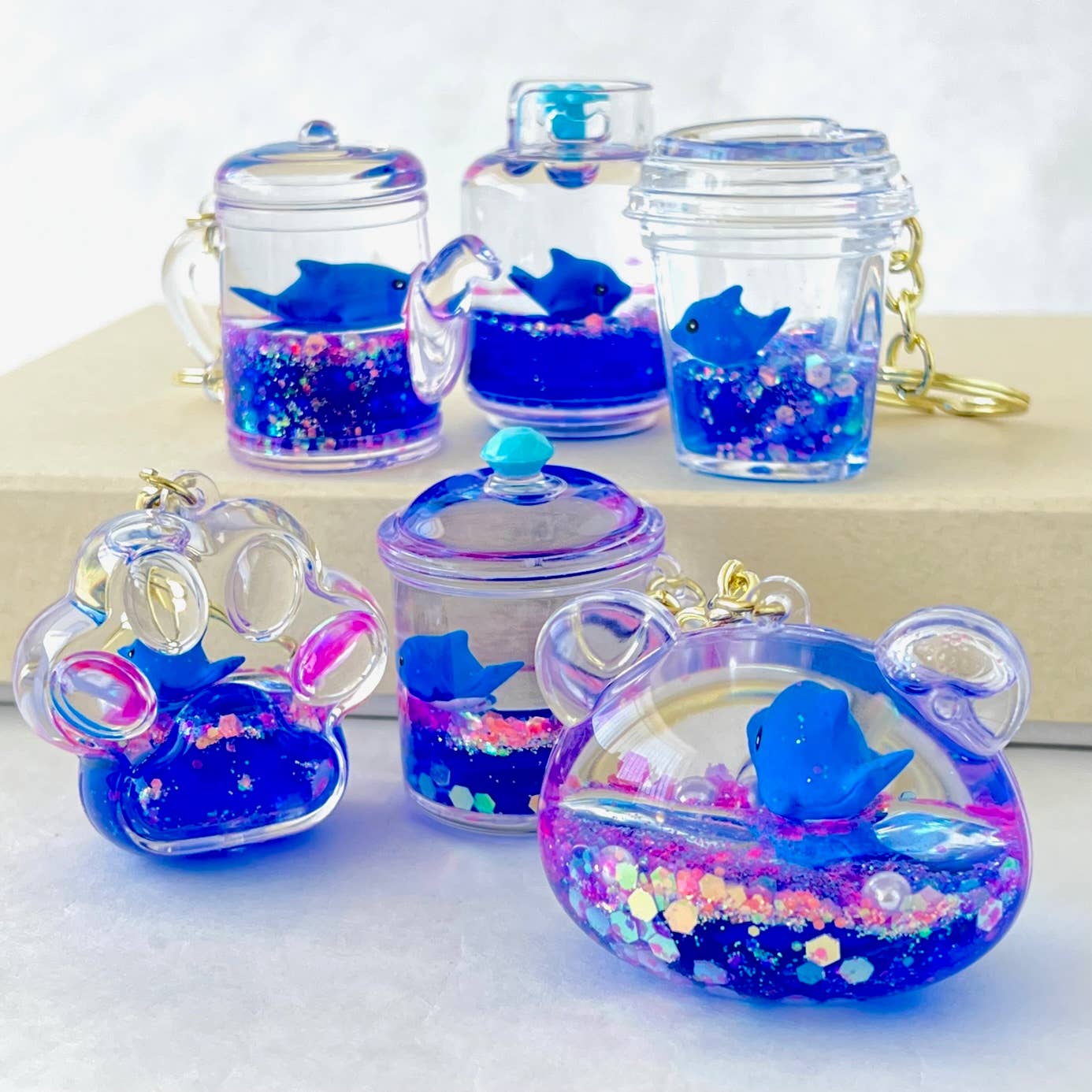 12129 BLUE DOLPHIN COMBO FLOATY KEY CHARM