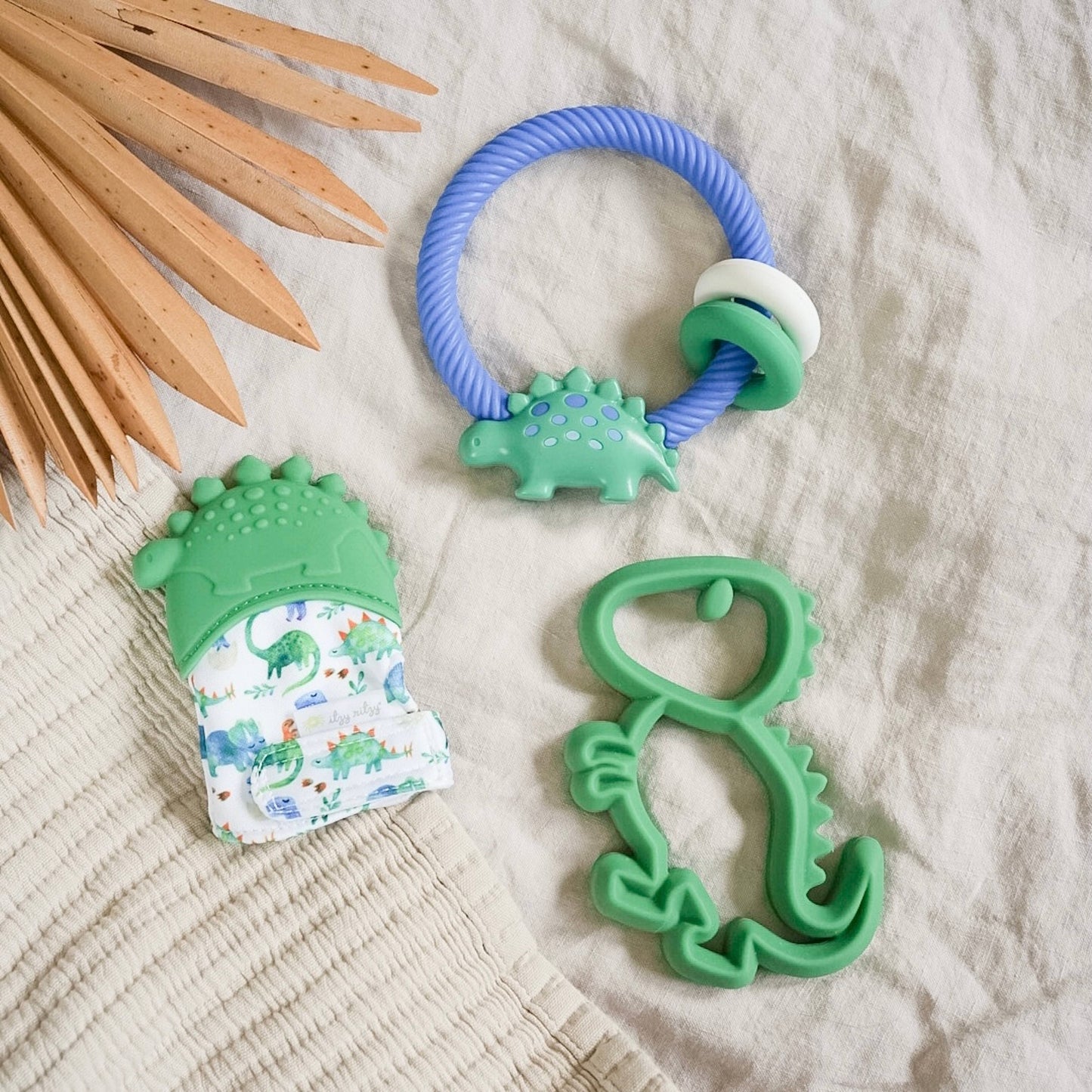 Itzy Mitt™ Silicone Teething Mitts: Lilac Dino